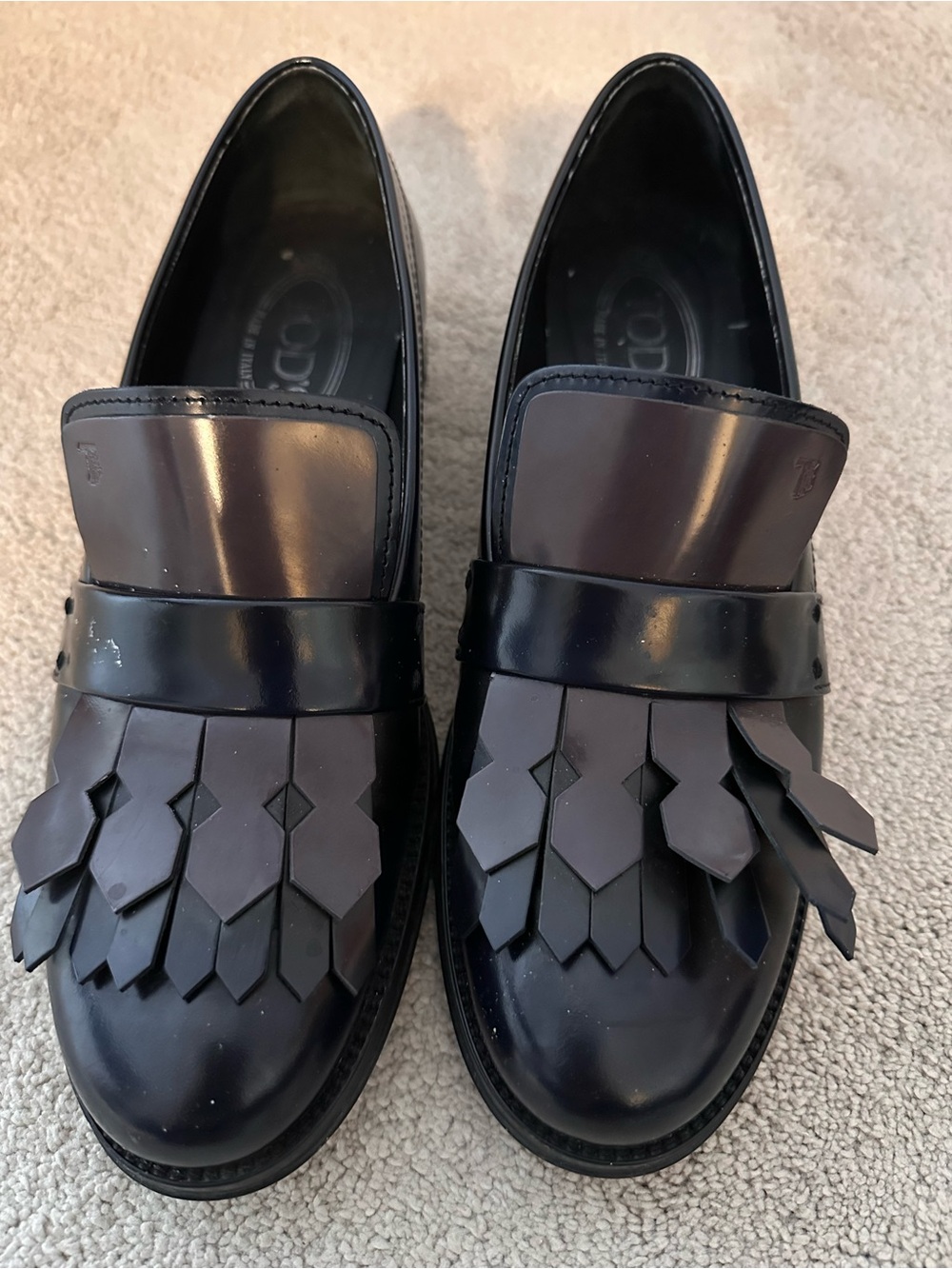 Tod's Black Leather Kiltie Penny Loafers